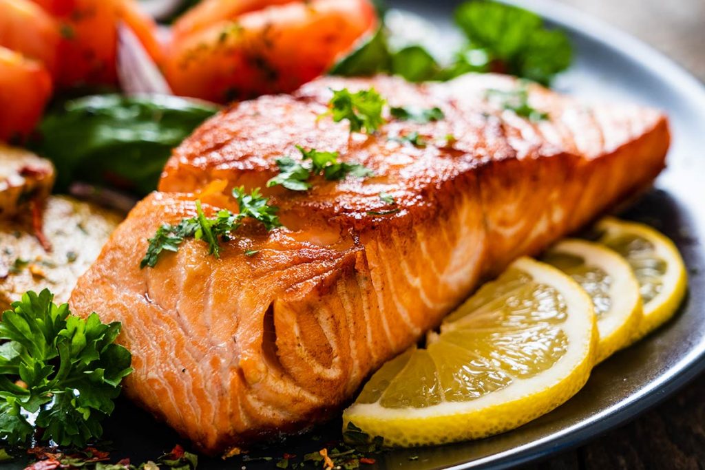 A colorful picture of a plate of salmon, which is a good food to fuel mental health.