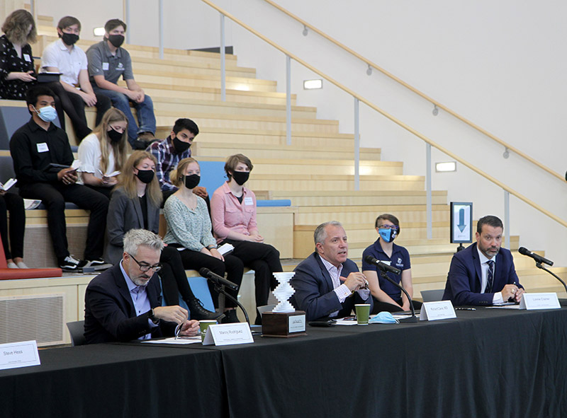 Part of the UCHealth expert panel, from left, Manny Rodriguez, chief marketing, experience and customer officer, Dr. Richard Zane, UCHealth’s chief innovation officer and professor and chair of emergency medicine at CU School of Medicine, Lonnie Cramer, president of Longs Peak Hospital, ask questions of the presenters of the "Hospital Room of the Future" challenge, while their peers watch, at the Innovation Center of St. Vrain Valley Schools.