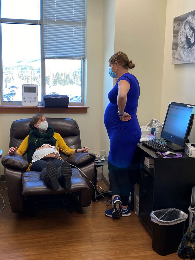 Should pregnant women get COVID-19 vaccines? Dr. Anne Euser is encouraging them to do so. Here, she poses for a photo during a checkup with patient, Aimee Straw.