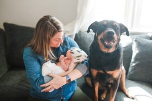 Should pregnant women get COVID-19 vaccines? Here, Dr. Anna Euser poses with her newborn daughter, Nell, and her dog, Dutch.