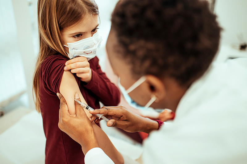 Needle phobia is very common among kids and adults, but help is available. Here, a little girl looks nervous as she gets a vaccine.