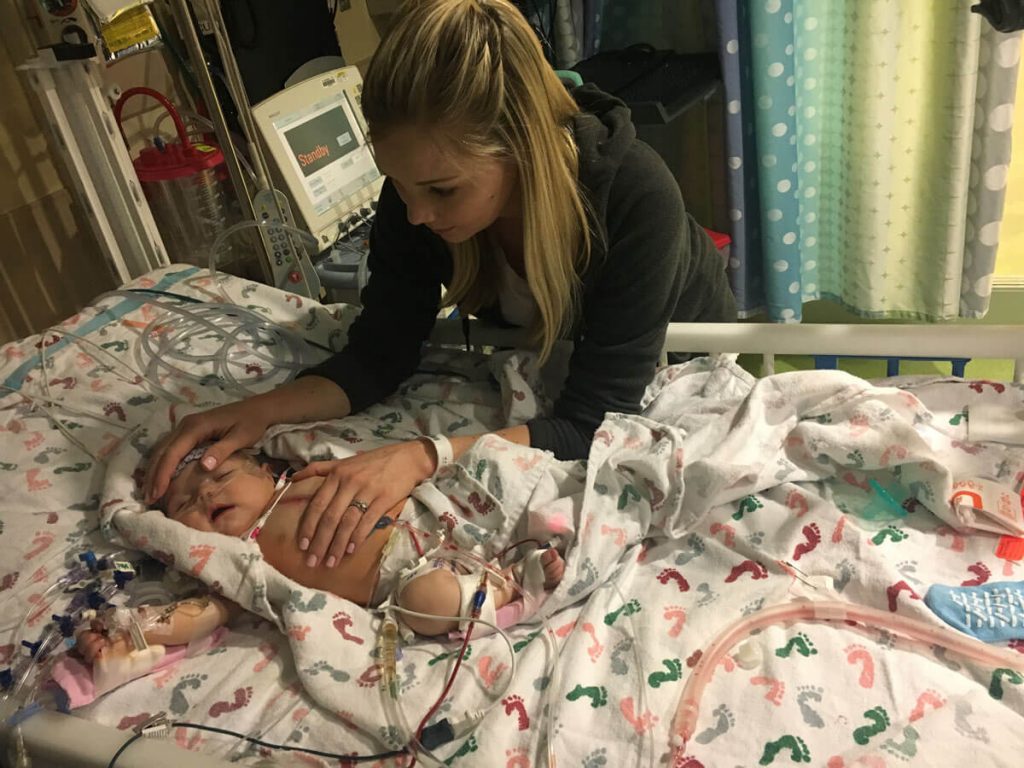 Hannah and her 11-week-old daughter Raegan in the ICU in October 2011. Raegan underwent open heart surgery at age 11 weeks to repair gaps in the walls between the left and right sides of her heart. Photo courtesy of Hannah Holt.