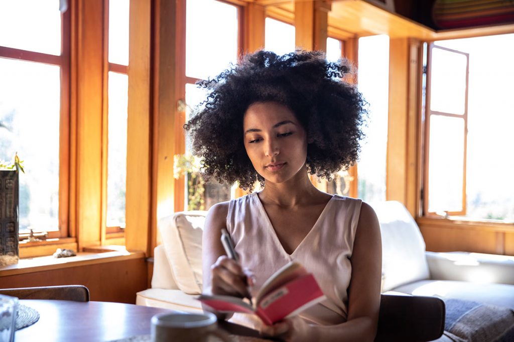 A woman writing in a journal