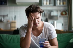 man feeling hungover wondering how to stop day drinking.