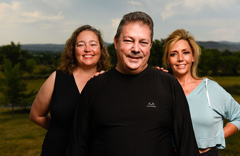 immunocompromised man and his sisters who are happy he will be able to get a third dose of the COVID-19 vaccine.