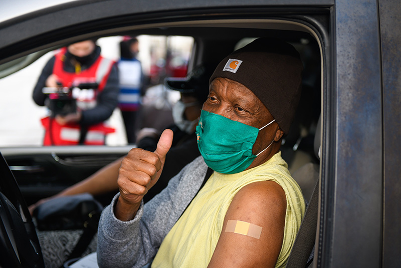 A gentleman receives a COVID-19 vaccine during a mass vaccination event earlier this year at Coors Field in Denver.