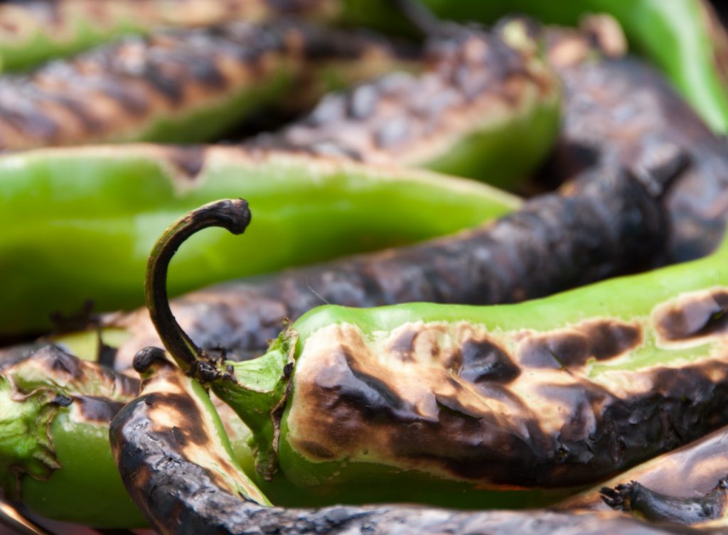 A photo of roasted Colorado green chile peppers.