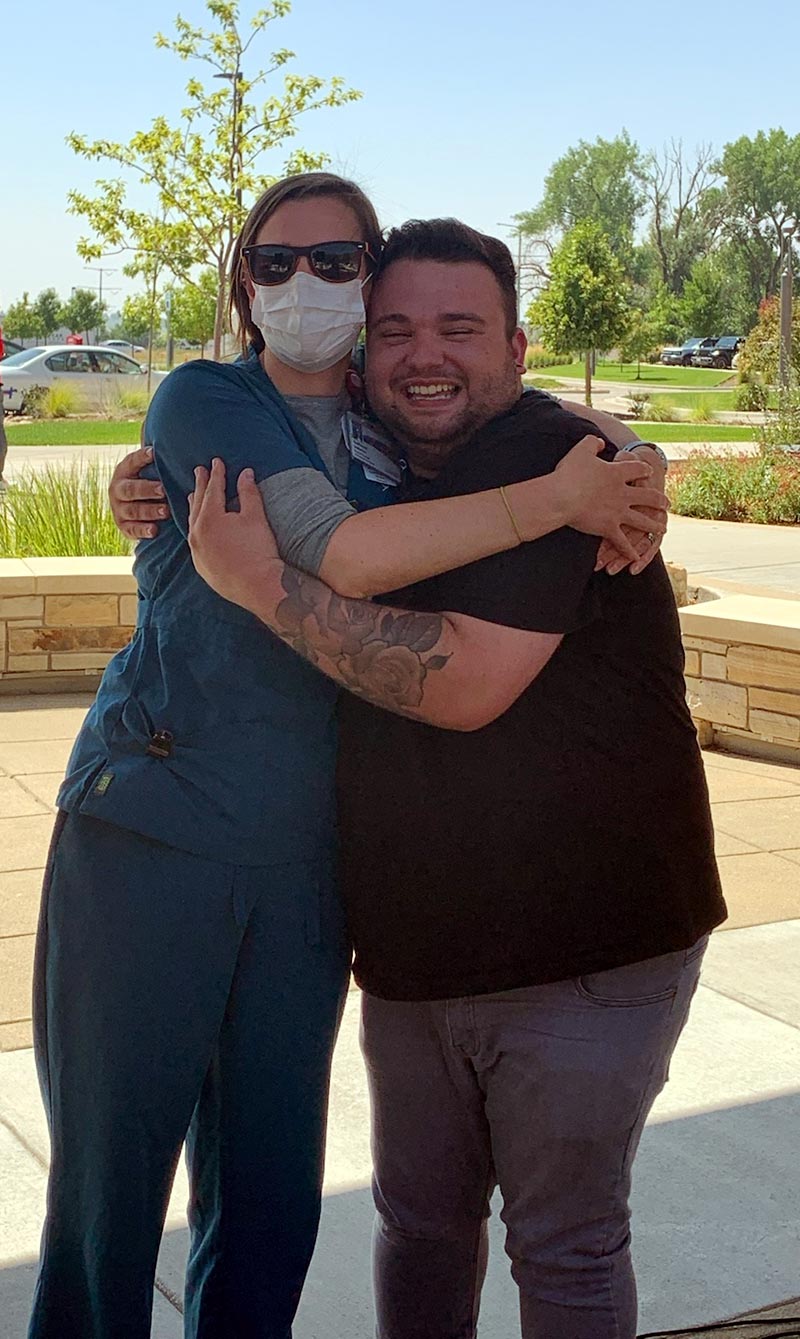 Jacob Larson with his former Longs Peak Hospital physical therapist, kathleen Loetscher. Photo courtesy of Sarah Braun.