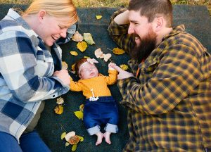 Sarah and Andrew Mays gaze adoringly at their daughter, Kabrini. Sarah was about 6 months pregnant when she got a fierce case of COVID-19 that almost killed her.