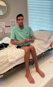 photo of covid survivor Nathan, who is sharing his story, after he lost 1/3 his body weight.