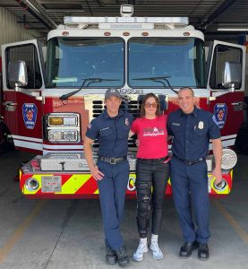 Prystayko, a triathlete, stopped by the Hudson Fire Protection District to thank two of the firefighters who had rescued her from her car crash.