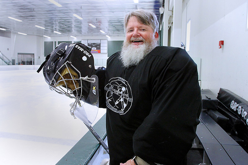 Dennis Borland, a hockey player, encourages people to become blood donors.
