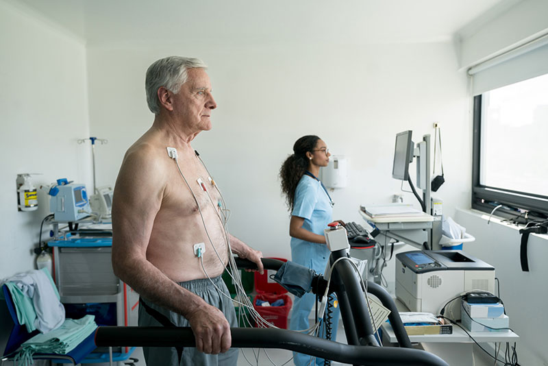 man getting a cardiac test done in a clinical setting as part of a research project