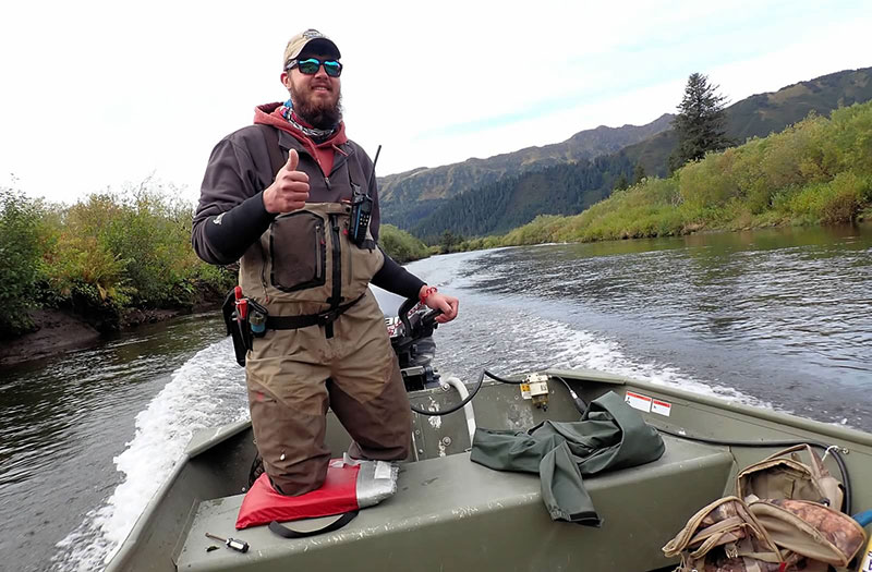 Seth Kloberdanz takes a fishing boat down an Alaska river. A painting at Poudre Valley hospital painting inspired this patients future love of fly-fishing. Photo courtesy of Seth Kloberdanz.