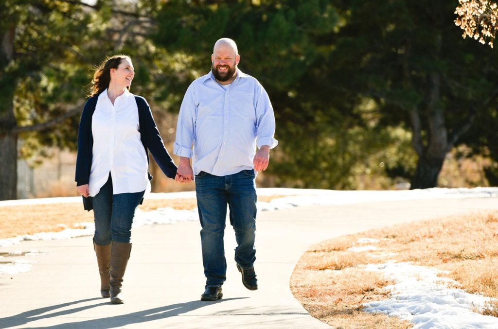 couple holding hands. Lang recently became the first patient with a high BMI to get a kidney transplant in Colorado because of robotic surgery.