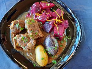 Garlic lamb stew and beets glazed with orange and honey