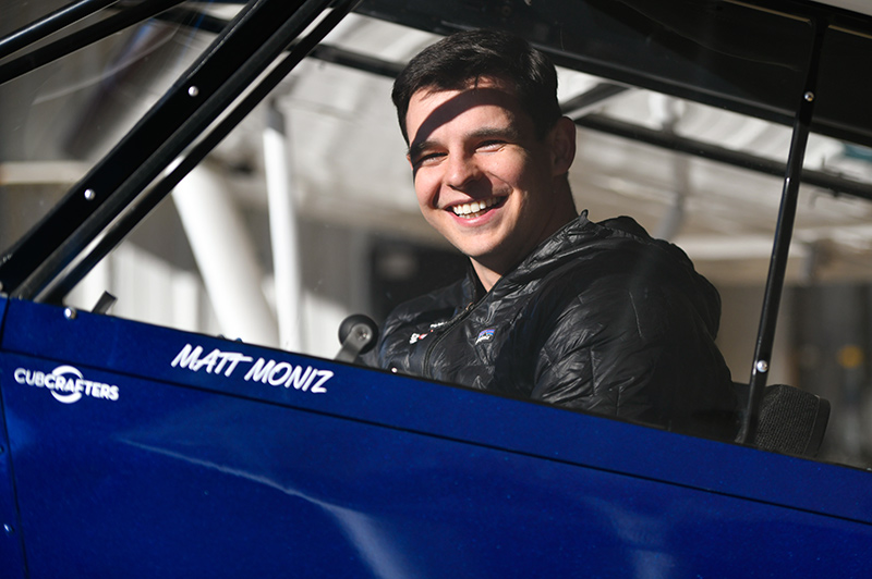Matt Moniz grins in his airplane. He's a LASIK success story and has perfect vision, which makes mountaineering and flying much easier.