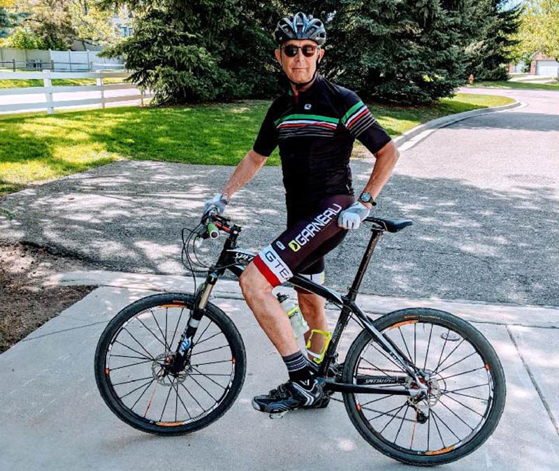 Steve Szymanski on his gravel bike, his battle with amyloidosis, a disease caused by exposure to Agent Orange, behind him... Photo courtesy of Steve Szymanski.