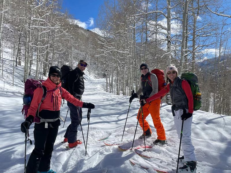 Skiers on a trail during a hut trip in Colorado.