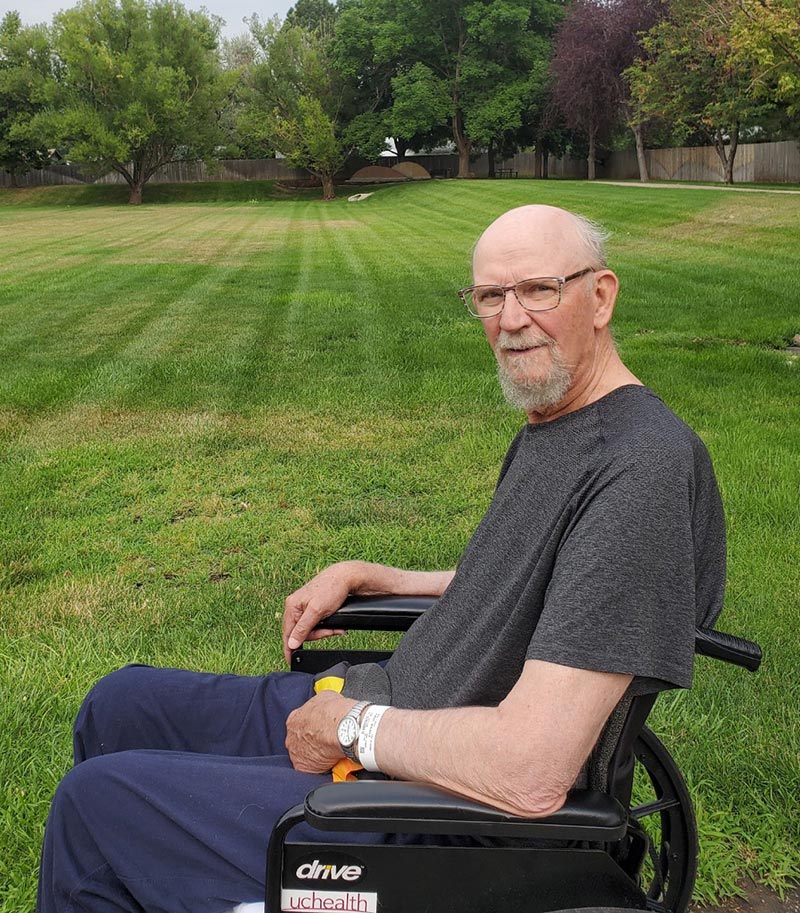 Bill Patton enjoys some fresh air while at the inpatient rehab unit at UCHealth Poudre Valley Hospital in the summer of 2021. Photo courtesy of Sally Patton.