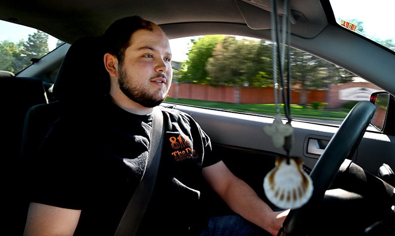 Jack O'Donnell, who is living with oligodendroglioma, cruises through his Centennial neighborhood in his 2008 Mustang.