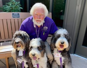 A photo of Bob Newton and Alphie, Willie an Toby