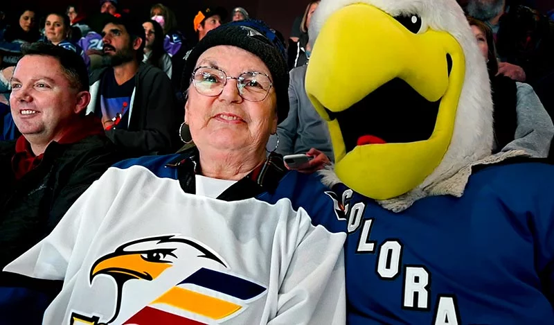 The Eagle mascot found Toni and her son, John VanLaningham (CQ), in the stands. John had flown in from New York to be with his mother and sisters for the game that honored cancer survivors.