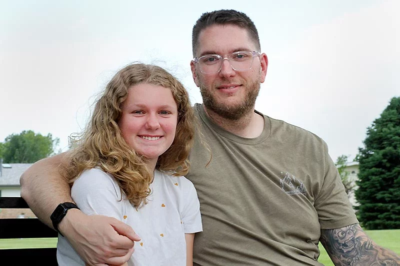 Dave McLarty and his 11-year-old daughter, Madilynn, pictured together in June, months after he survived a sudden cardiac arrest during a parent-daughter basketball game. Dave survived thanks to the quick actions of bystanders who performed CPR and used an AED. Photo by Joel Blocker, for UCHealth.