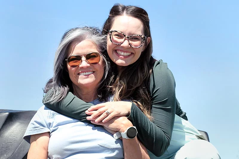 Lily Wyn with her mom, Lee Belanger. Lee’s commitment to a healthy lifestyle inspired Lily’s career in health education, so when her mom called with classic heart attack symptoms, it was a bit of a shock to them both. Photo by Joel Blocker, for UCHealth.