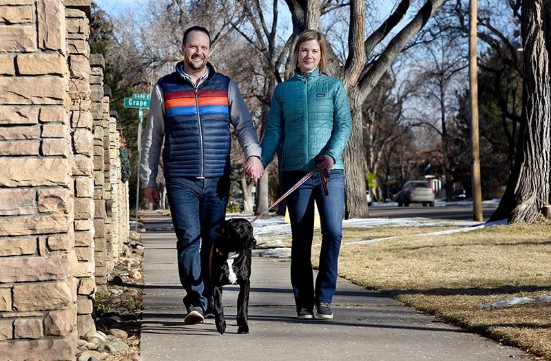 Kate, John and Lindy enjoy a walk in Denver's Park Hill neighborhood. Days after her sudden cardiac arrest when she was only 40, Kate was so exhausted that she could barely walk to the end of the block to watch the neighborhood Fourth of July parade. Within months, however, she had completed cardiac rehabilitation and has recovered fully. Photo by Sonya Doctorian, UCHealth.