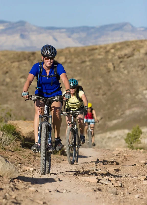Friends enjoy a mountain bike ride near Fruita, Colorado. Safety is always important when mountain biking, but even more so as mountain e-bikes become more prevalent on the trails. Photo by Matt Inden/Miles, courtesy of the Colorado Tourism Office.