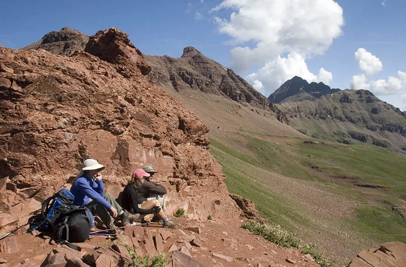 Hikers rest in Maroon Bells Wilderness near Aspen, Colorado. Photo by Matt Inden/Miles, courtesy of Colorado Tourism Office.