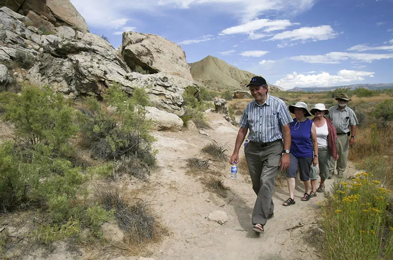 Hikers enjoy the history of Dinosaur National Monument. Photo by Matt Inden/Miles, courtesy of Colorado Tourism Office.