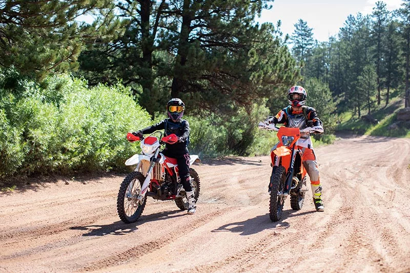 Two motorcycles, who attended a safety ATV program in Colorado, ride a Colorado mountain trail