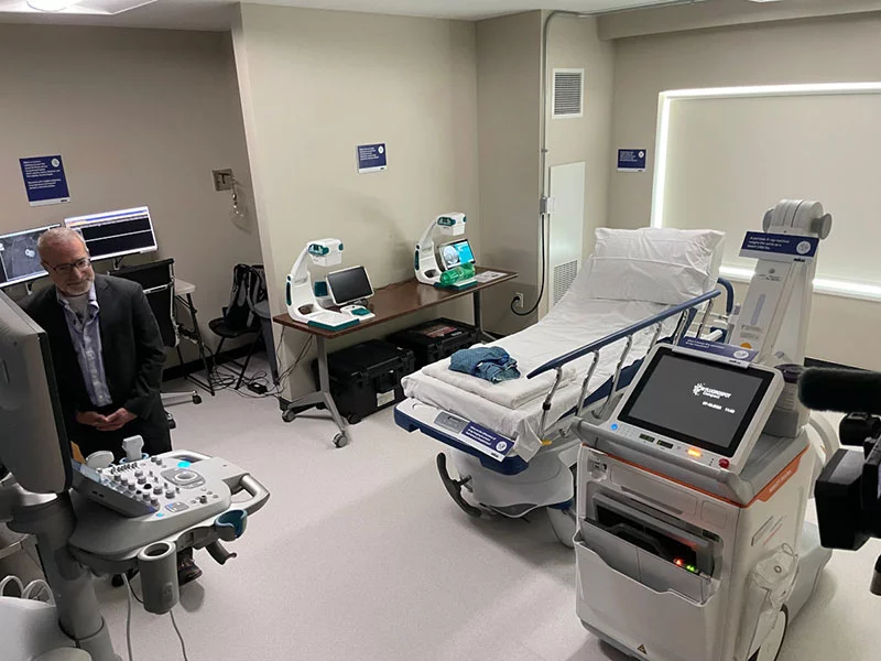 Persoff in the radiology suite, formerly (and soon to be again) the Hyatt’s room 228. The 1,100-pound mobile X-ray machine in the foreground led the team to put extra thought into the flooring. Photo by Todd Neff for UCHealth.