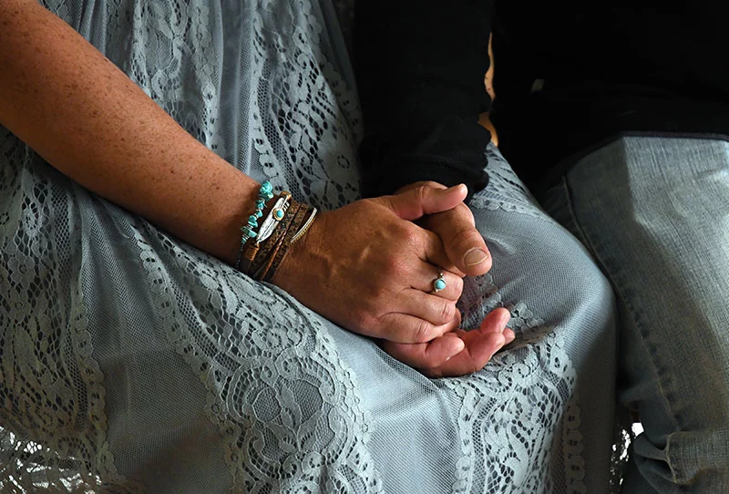 Teresa and Tony hold hands. He was a dedicated supporter during her frightening illness and long recovery, staying by her side at the hospital for her entire 40-day stay. Photo by Kathryn Scott, for UCHealth.