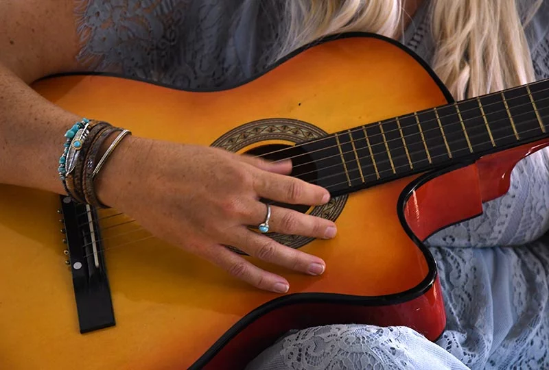 Teresa plays the guitar. During her hospital stay, her family played music in her room while she recovered to create an upbeat vibe. Photo by Kathryn Scott, for UCHealth.