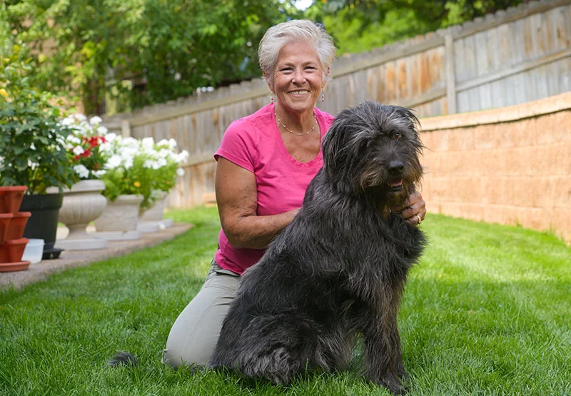 Audrey with her dog, Bella. After a second surgery and intense physical therapy, Audrey is thrilled to be moving well again and hopes to inspire others who may feel like giving up. Photo by Cyrus McCrimmon, for UCHealth.