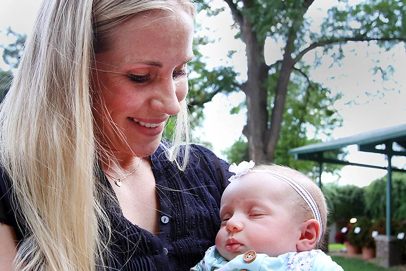Kirsten Martin holds Adeline Martin, who was born at UCHealth Poudre Valley Hospital on May 8, 2025. Adeline is the newest descendant of northern Colorado homesteaders named the Delehoys. Over four generations, the family has welcomed 12 babies at the Fort Collins hospital, which is celebrating its 100th birthday this year. Photo by Joel Blocker, for UCHealth.