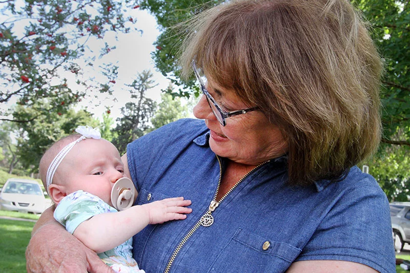 Karen Follett, with granddaughter Adeline Martin, the newest Delehoy descendant, who was born in May. Photo by Joel Blocker, for UCHealth.