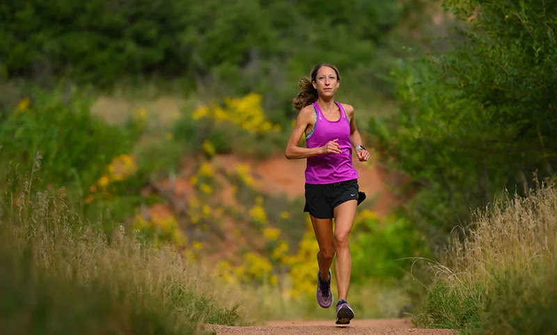 Dr. Anne Flower, a UCHealth ER doctor in Colorado Springs, loves to run in Red Rock Canyon Open Space, within view of Pikes Peak. She entered the Leadville Trail 100 race this summer with a goal to finish. She surpassed that goal by setting a new women's course record in her debut 100-mile race. Photo by Mark Reis, for UCHealth.