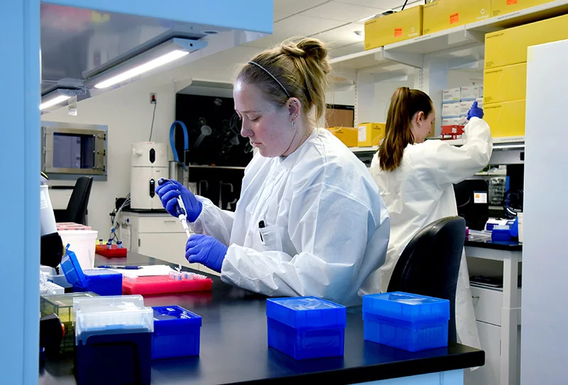 Lab technologists Leah Burnett (left) and Erin Culver (right), prepare genetic samples at the Colorado Center for Personalized Medicine biobank laboratory.Photo by Sonya Doctorian, UCHealth.