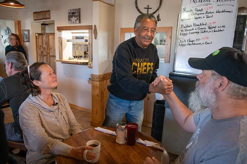 Loree Lund and her husband, Chris Lund, talk with Willie. Loree became an important part of his search for a kidney donor. Photo by Chuck Bigger, for UCHealth.