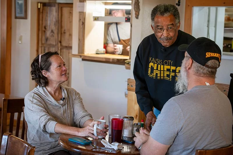 Loree Lund and her husband, Chris Lund, talk with Willie Quinney. Loree became an integral part of Willie's search for a kidney donor. Photo by Chuck Bigger, for UCHealth.