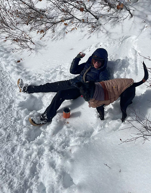 Creek's End resident Alma Johnson plays in the snow with her dog, Zia. Alma is thrilled to be living and working in Steamboat Springs, where she was able to qualify for affordable housing thanks to her job at Yampa Valley Medical Center. Photo courtesy of Alma Johnson.