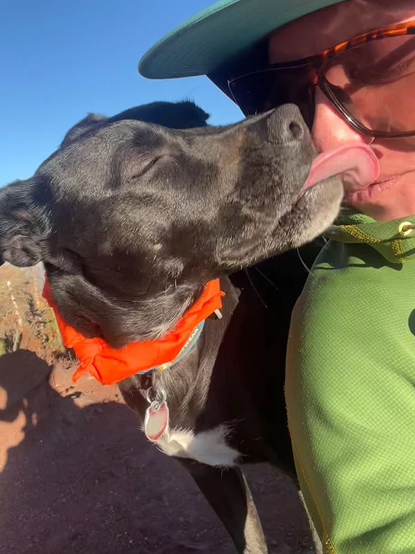 Creek's End resident Alma Johnson poses with her dog, Zia. Alma Johnson receives a kiss from her rescue dog, Zia. Alma was thrilled to find a job and a dog-friendly home in Steamboat Springs thanks to affordable housing that Yampa Valley Medical Center provides to employees. Photo courtesy of Alma Johnson.