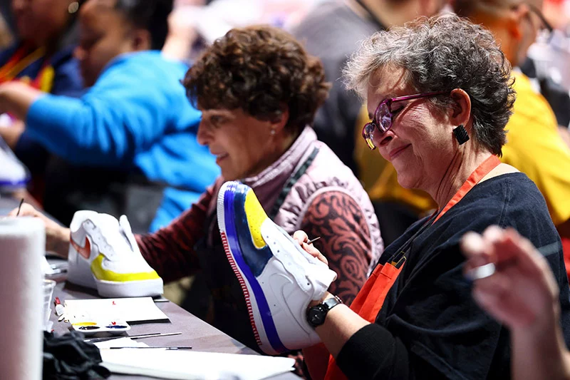 Nuggets fans enjoyed doing unique shoe designs during the Soleful Connections event. Clarkson Creative Photography, for UCHealth.