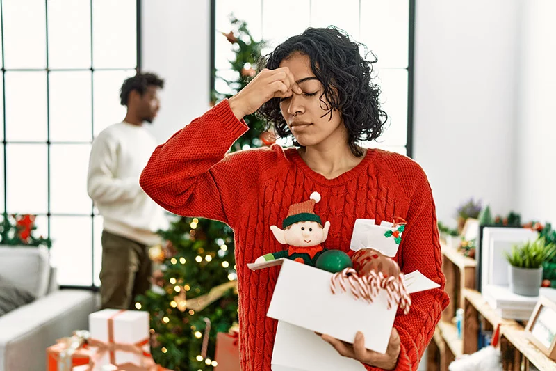 Women stressed out doing the holidays. The holidays aren't always wrapped in cheer, but there are ways to relax your body and support your mental well-being. Photo: Getty Images.