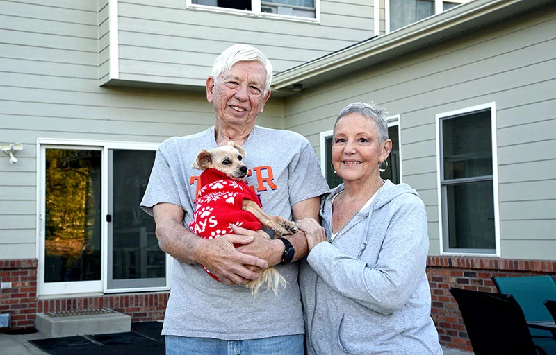 Linda and Edgar celebrated their 55th wedding anniversary Dec. 27, 2025. Edgar holds Miley, a Maltese/Yorkie mix. Edgar's treatment for his enlarged prostate has given him relief, allowed him to sleep through the night and gotten him off his BPH medications. Photo by Sonya Doctorian, UCHealth.