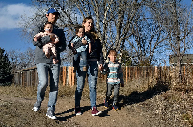 The Tran family walks the High Line Canal trail near their family home in Centennial, Colorado. Photo by Sonya Doctorian, UCHealth.